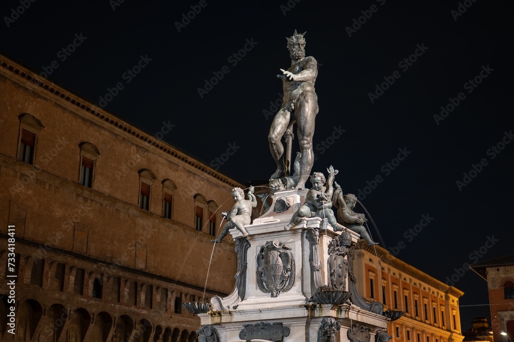Il Nettuno (Fountain of Neptune) statue at Piazza del Nettuno town square, Bologna at night