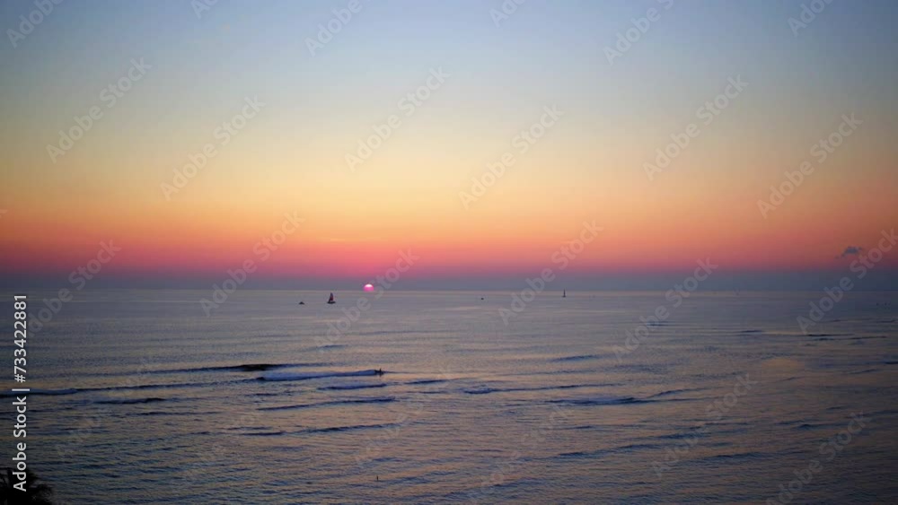 Aerial Shot Of Nautical Vessels Sailing In Wavy Sea Against Dramatic Sky, Drone Flying Backwards During Sunset - Honolulu, Hawaii Aerial Shot Of Nautical Vessels Sailing In Wavy Sea Against Dramatic Sky, Drone Flying Backwards During Sunset - Honolulu, Hawaii
