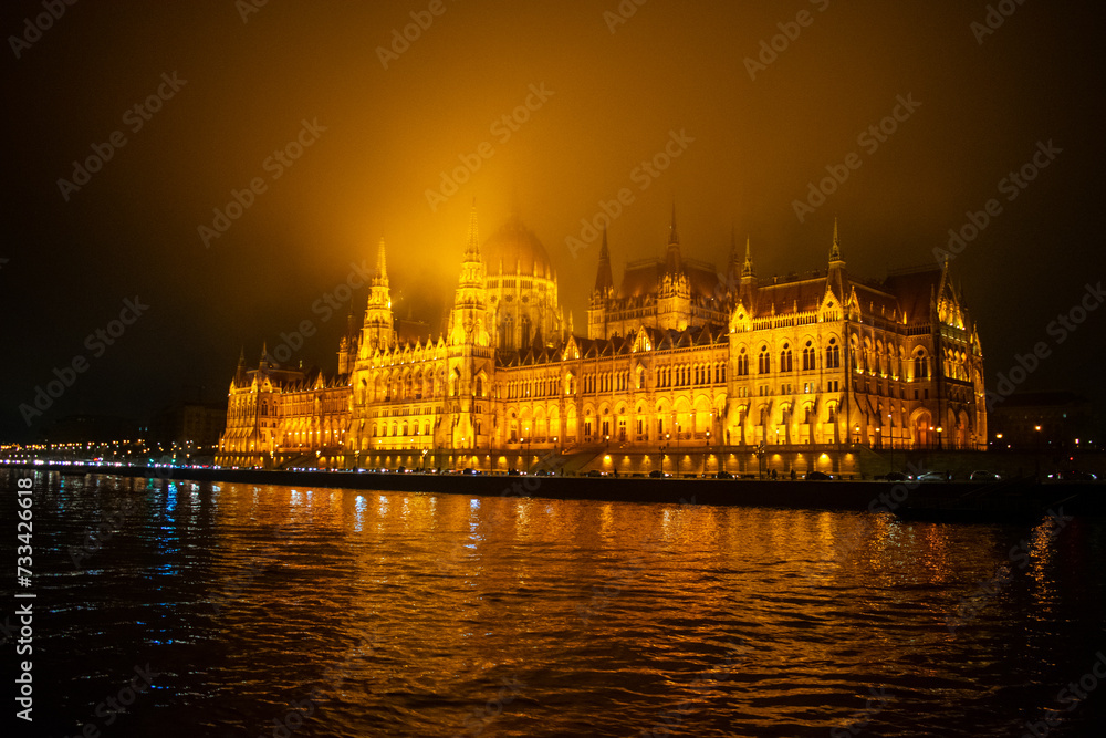 Fototapeta premium Parliament building in Budapest, Hungary at Night. Danube river and City at night