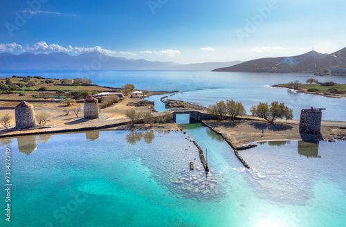 The famous canal of Elounda with the ruins of the old bridge, Crete, Greece. photo