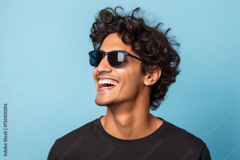 Stylish Indian Man: Portrait with Sunglasses on Light Blue Background generative ai Stylish Indian Man: Portrait with Sunglasses on Light Blue Background generative ai