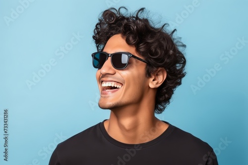 Stylish Indian Man: Portrait with Sunglasses on Light Blue Background generative ai