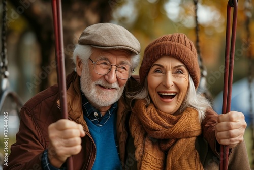 A joyful couple captures a timeless moment of love and fashion, as the man's glasses and beard complement the woman's scarf and hat in their outdoor portrait