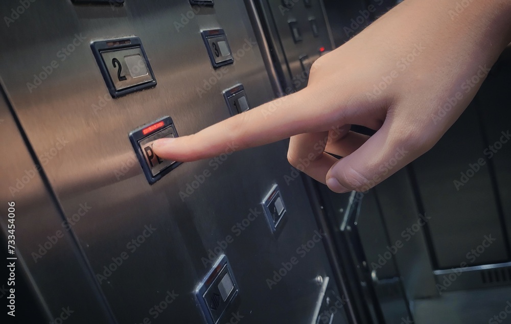 Hand holding button Hand holding button