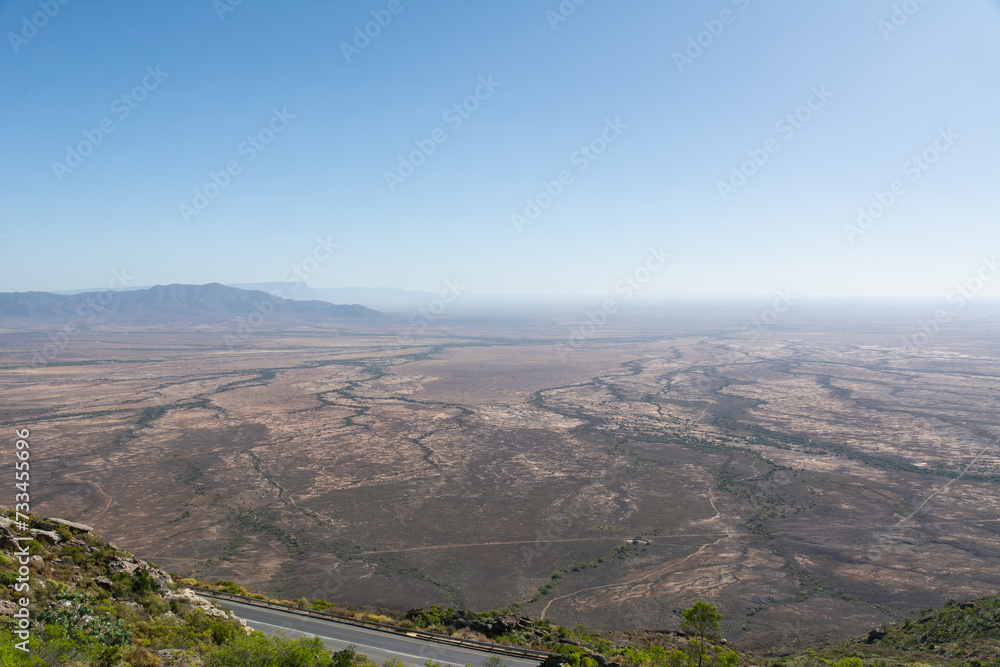 View from Vanrhyns Pass on Road R27 at the Northern Cape Province in South Africa under blue sky.