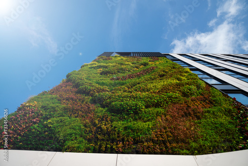 Obraz na płótnie green construction - beautiful natural facade of an office building - ecological construction - ESG policy w salonie