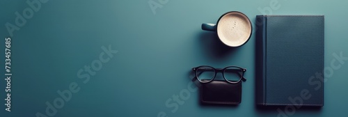 Extra wide banner header flatlay image with dark color scheme using leather and linen design details ideal for modern contemporary business or corporate product mockup, scene creator, text background  © Andrea