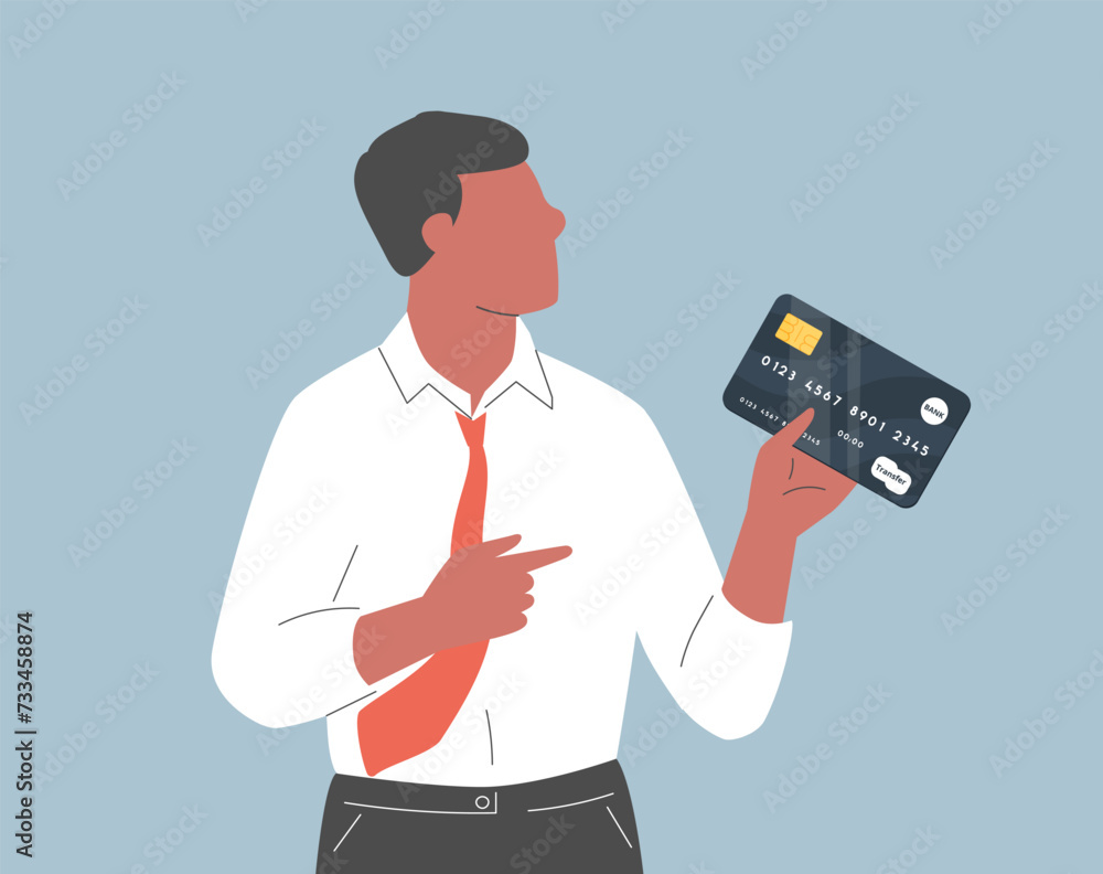 Young smiling man holding and pointing to credit debit card or digital payment card. Payment, banking shopping concept Young smiling man holding and pointing to credit debit card or digital payment card. Payment, banking shopping concept