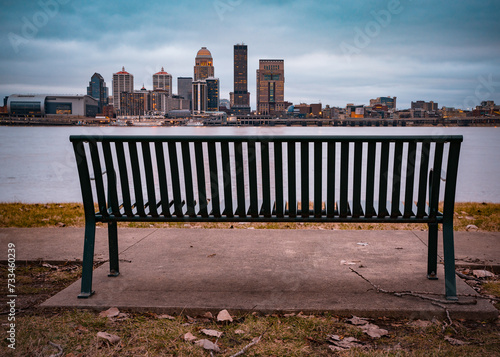 Louisville Kentucky skyline with Ohio River and bench