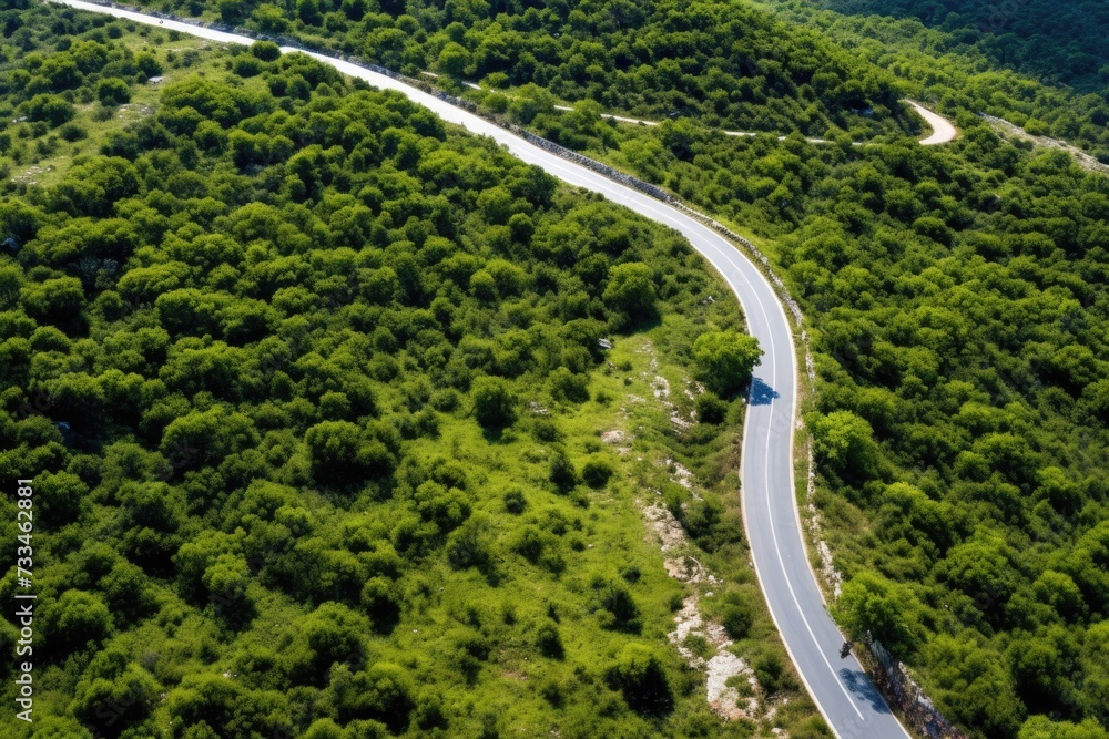 Aerial view of car on road in Sardinia, Italy.