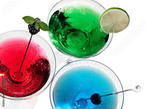 Red, green and blue martini cocktails, top view, close up on white background