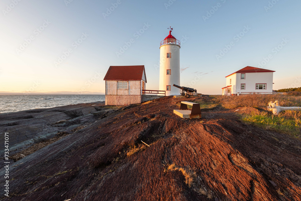 At the sunset the Lighthouse of L’Isle-Verte (Notre-Dame-des-Sept-Douleurs, L’Isle-Verte, Quebec, Canada) At the sunset the Lighthouse of L’Isle-Verte (Notre-Dame-des-Sept-Douleurs, L’Isle-Verte, Quebec, Canada)