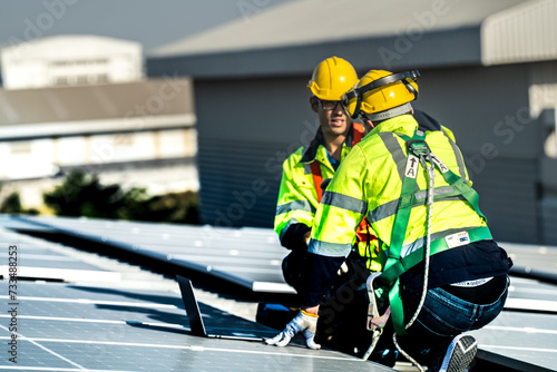 Worker Technicians are working to construct solar panels system on roof. Installing solar photovoltaic panel system. Alternative energy ecological concept. Renewable clean energy technology concept. © ultramansk