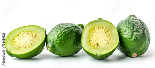 Feijoa fruit on white background, vegan and raw, as a juice ingredient with skin. photo