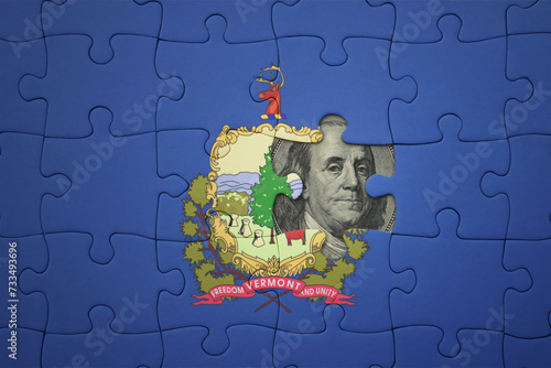 puzzle with the national flag of vermont state and usa dollar banknote. finance concept photo