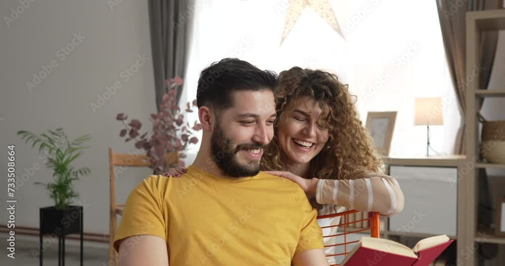 man and woman caucasian adult couple read book at home man and woman caucasian adult couple read book at home