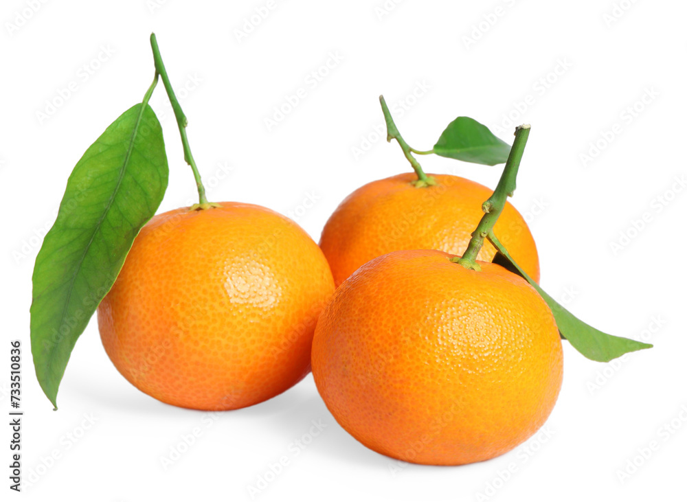 Fresh ripe juicy tangerines with green leaves isolated on white Fresh ripe juicy tangerines with green leaves isolated on white