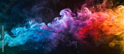 Colorful smoke from a vape on a black background.