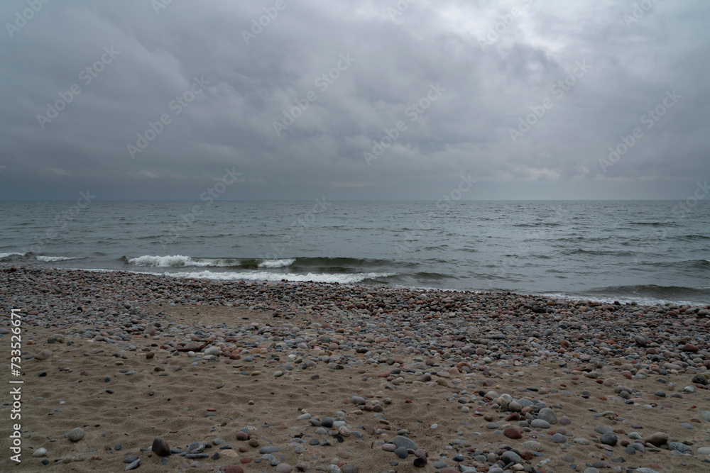 View of the Baltic Sea and a pebble beach on a cloudy summer day, Svetlogorsk, Kaliningrad region, Russia