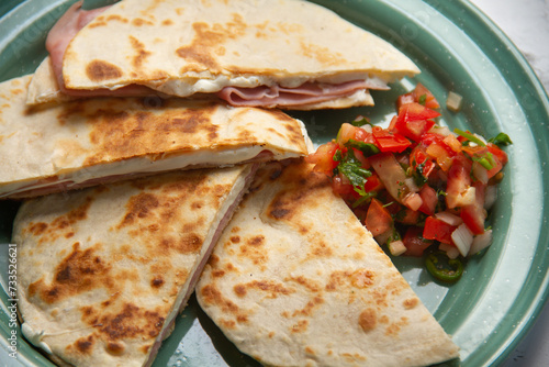 Savory stacks: Sincronizadas with melted cheese and ham. photo