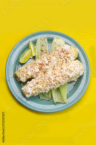 Mexican snack; Elotes with mayonnaise, cheese and chili powder