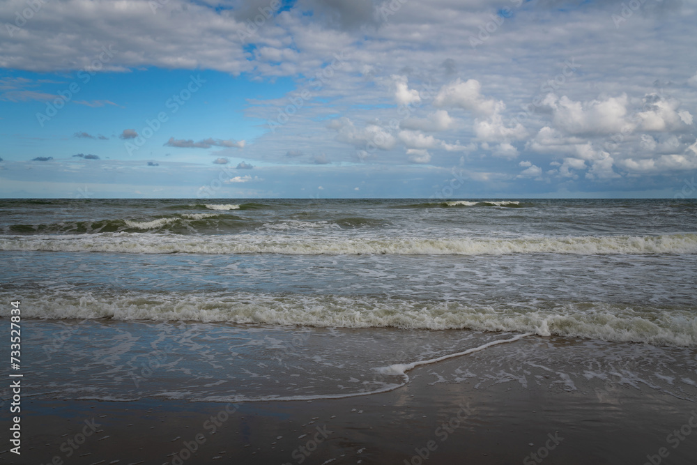 View of the incoming wave on the Baltic Sea on the shore of the Curonian Spit on a summer day, Kaliningrad region, Russia