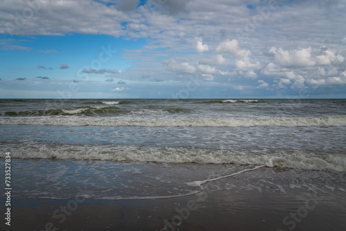 View of the incoming wave on the Baltic Sea on the shore of the Curonian Spit on a summer day, Kaliningrad region, Russia