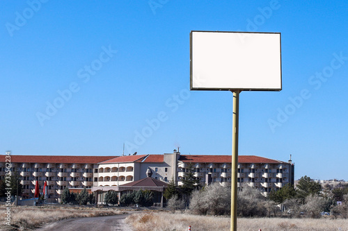 Mockup of white blank sign board stand in front of the building