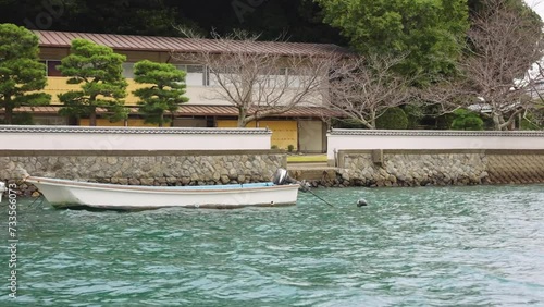 Boats in Harbor around Mikimoto Pearl Island in Toba Bay, Mie Japan photo