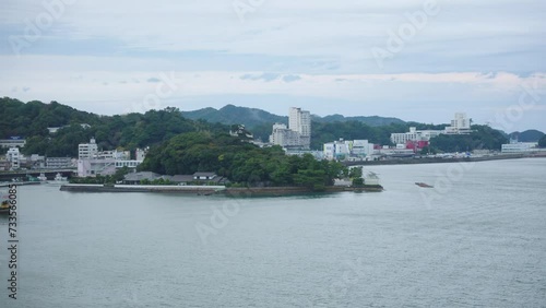 Toba Bay in Mie Prefecture, Port and Mikimoto Pearl Island in Bay photo