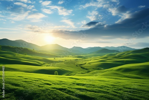Panoramic view of sunlit green rolling hills under a clear sky.