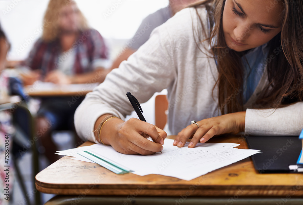 University, classroom and woman writing exam at desk for education, knowledge and opportunity. College, learning and student with paper for test, assessment and studying with books, notes or report. University, classroom and woman writing exam at desk for education, knowledge and opportunity. College, learning and student with paper for test, assessment and studying with books, notes or report.