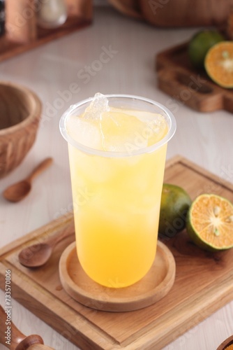 fresh orange juice with ice cubes