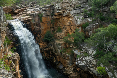 Majestic waterfall cascading down rocky cliffs