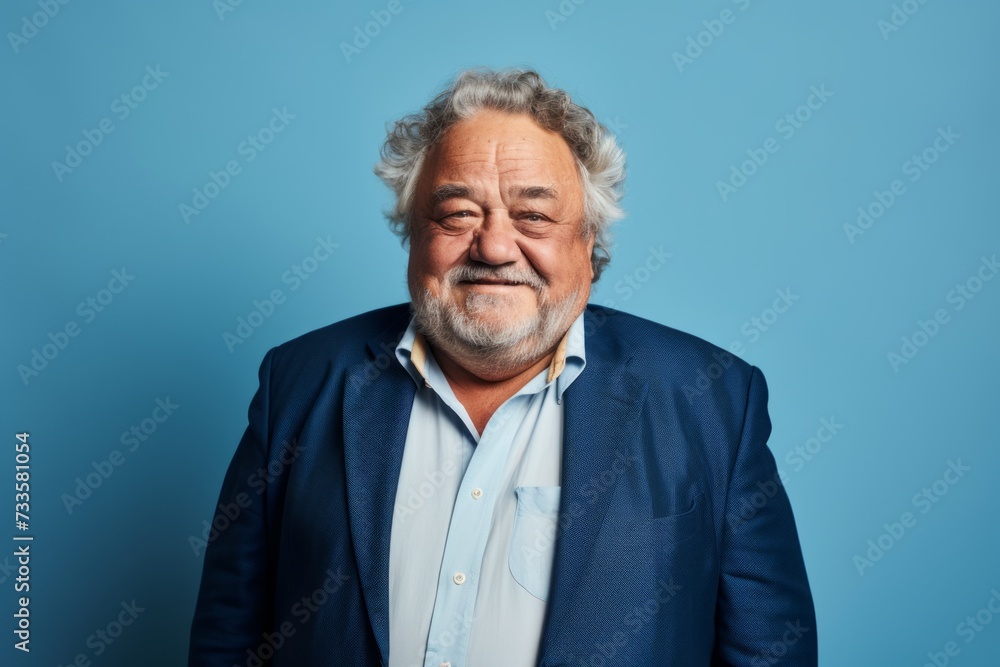 Portrait of an old man in a blue jacket on a blue background. Portrait of an old man in a blue jacket on a blue background.