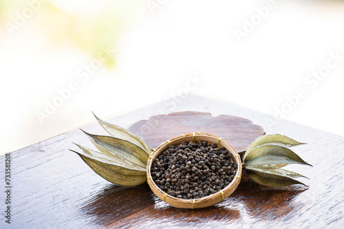 Abelmosk or Abelmoschus moschatus dired fruits and seeds on natural background. photo