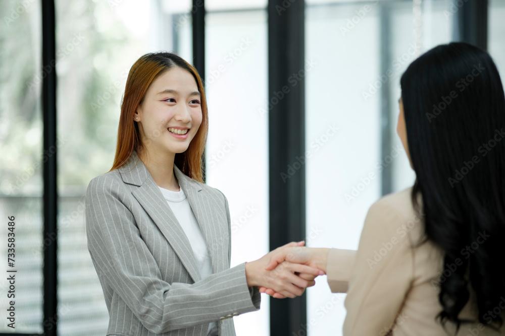 Accepting a business proposal with a handshake. Accepting a business proposal with a handshake.