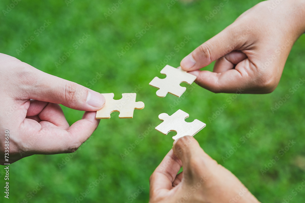 ESG Concept of teamwork and partnership Hands join Jigsaw puzzle pieces with global community sustainable Save Earth. ESG Concept of teamwork and partnership Hands join Jigsaw puzzle pieces with global community sustainable Save Earth.