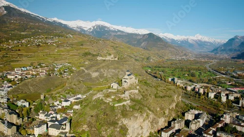 Panorama Of Valere Basilica And Tourbillon Castle In Sion, Canton Valais, Switzerland. Aerial Orbiting Shot photo