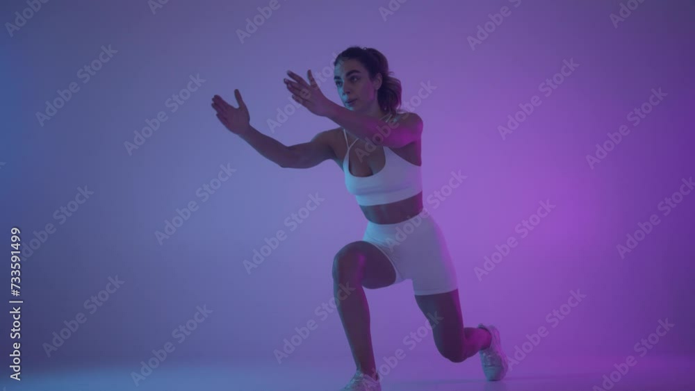 Functional training. Girl doing exercises in neon light. Functional training. Girl doing exercises in neon light.