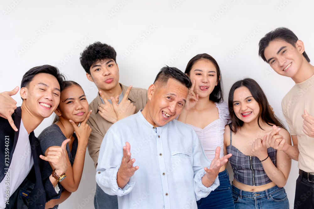Fun shoot with 6 young interns posing with their boss. Startup company showing solidarity and unity.