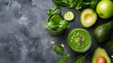 Vegetarian vegan healthy ingredients and green smoothie on grey stone background