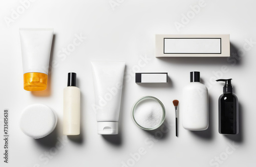 Body care concept flat lay. Top view creative organic cosmetics composition, white background. Natural beauty product advertising. Skin care cream, soap, serum, sea salt. Aromatherapy. Self-care kit