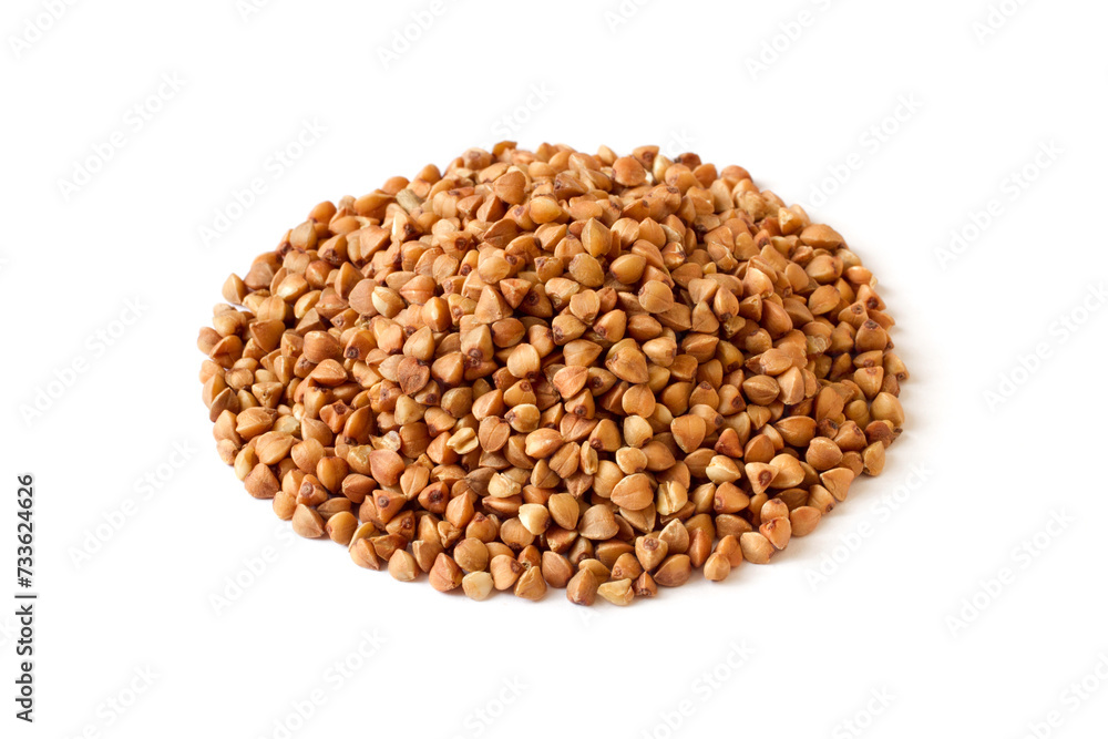 Pile of buckwheat groats isolated on white background. Buckwheat close-up. Pile of buckwheat groats isolated on white background. Buckwheat close-up.
