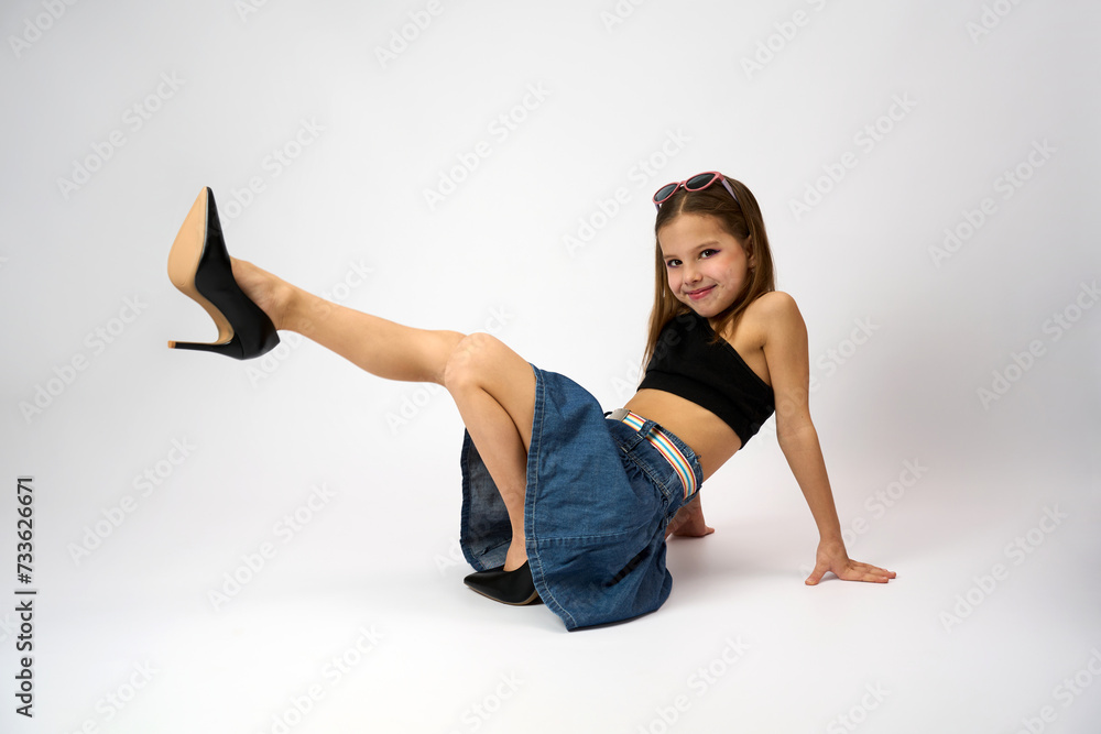 Portrait of a cute girl wearing high heels shoes Stock Photo | Adobe Stock