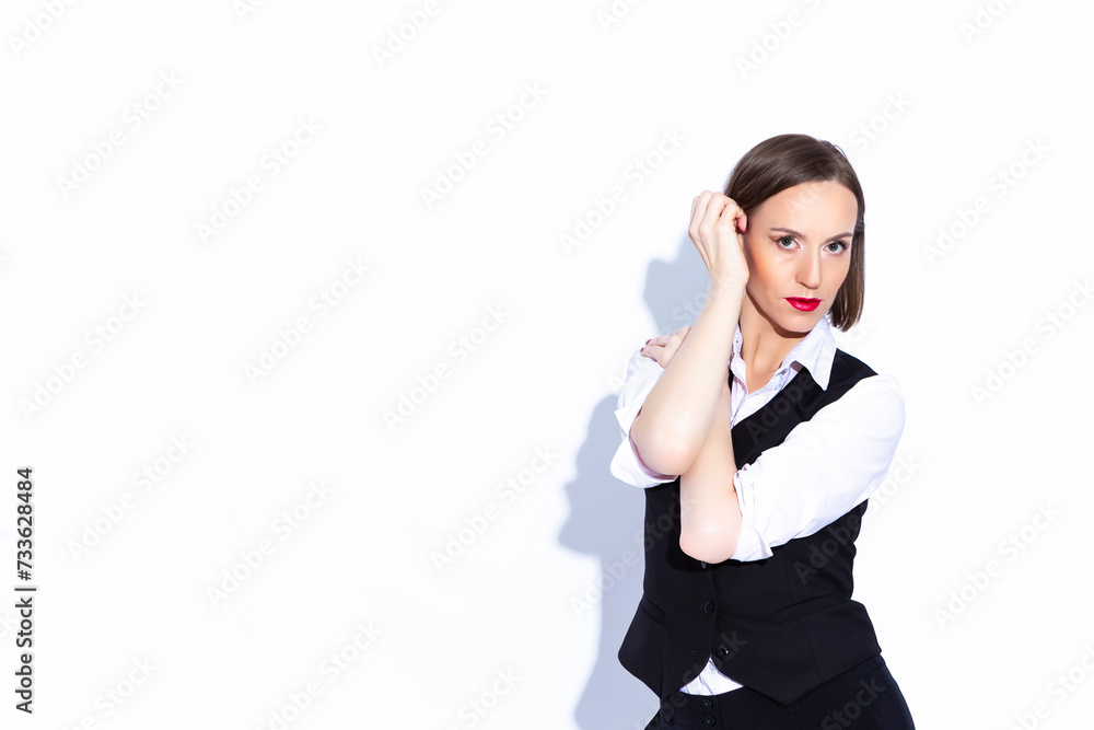 Portrait of Positive Confident Caucasian Business Woman in White Shirt Posing With Hands Folded In Front Turned Back On White Portrait of Positive Confident Caucasian Business Woman in White Shirt Posing With Hands Folded In Front Turned Back On White