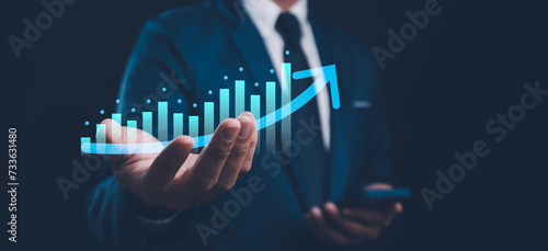 Business development to success and growing growth concept, Businessman hold arrow graph corporate future growth plan. Raise arrow chart digital transformation. Stock market and investment economy.