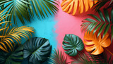 Vibrant tropical leaves artfully arranged on a gradient background of blue to pink hues.