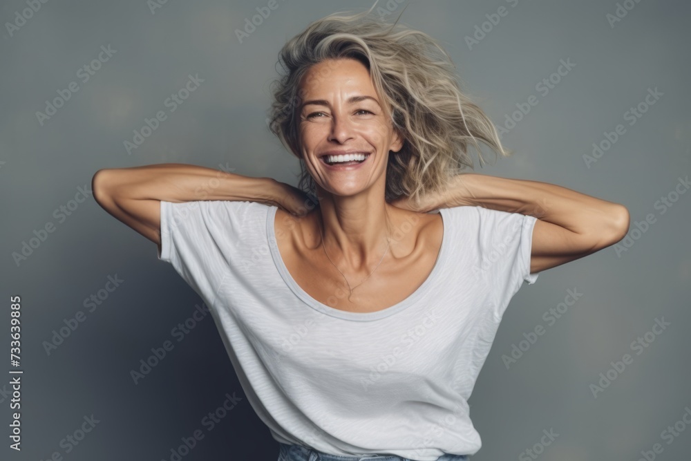 Portrait of a happy young woman laughing with her hair blowing in the wind Portrait of a happy young woman laughing with her hair blowing in the wind