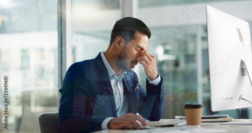 Business man, headache and tired on computer for information technology, online planning and office stress. Worker, programmer or developer with fatigue, pain or frustrated for mistake on desktop